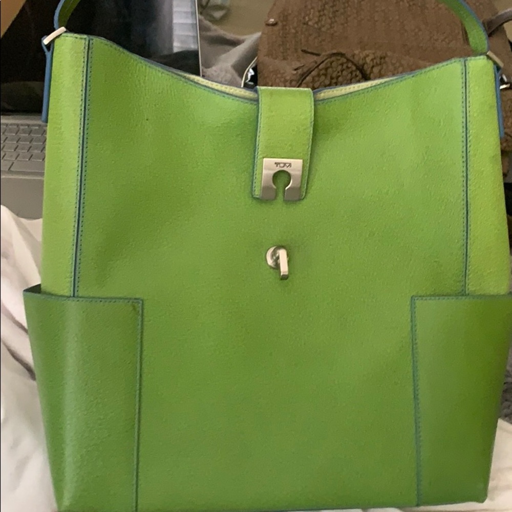 green Tumi bag